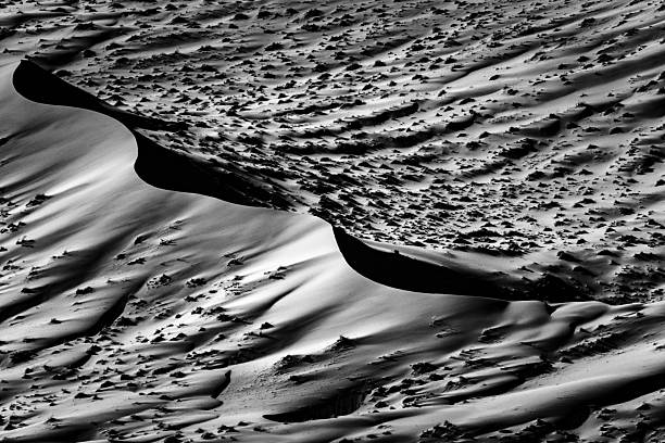 Sand dune in Namib desert in Black and white at sunset low light