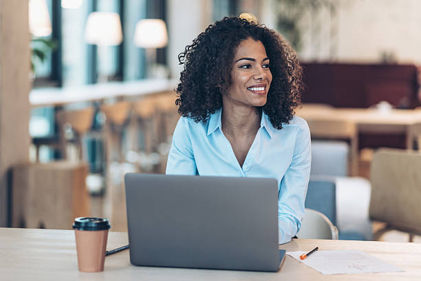 istock Cheerful black businesswoman in an open office space 2220980638