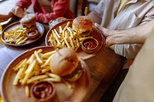 Classic burger and fries meal served in an inviting restaurant, ideal for food photography, marketing campaigns, and dining promotions.
