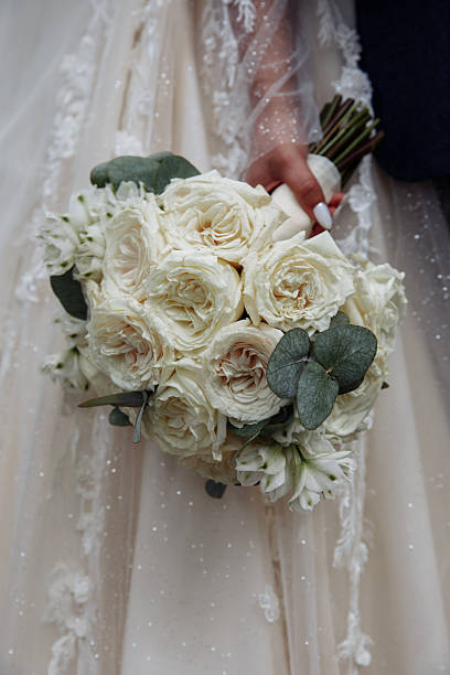 istock Bride holding wedding bouquet with beautiful flowers. 2220986978