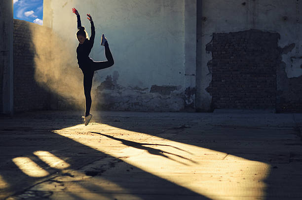 istock Ballerina dancing in an abandoned building 2220987069