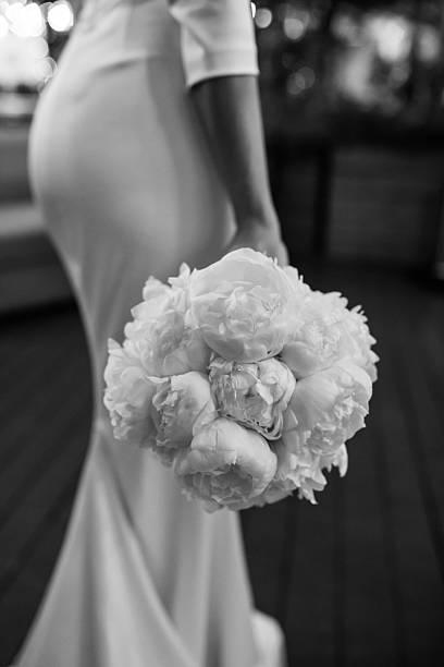 istock Bride holding wedding bouquet with beautiful flowers. 2220987285