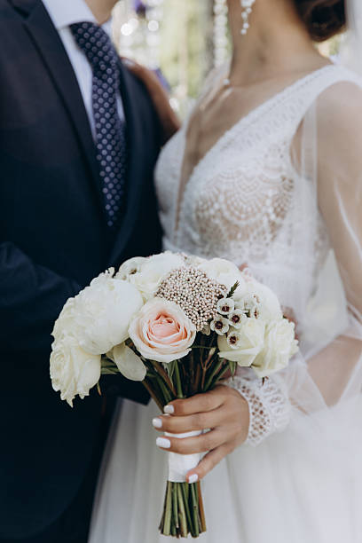 istock Bride holding wedding bouquet with beautiful flowers. 2220988746