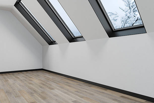 istock Minimalist Attic Interior with Sloped Skylights and White Walls – Unfurnished Space 2220988918