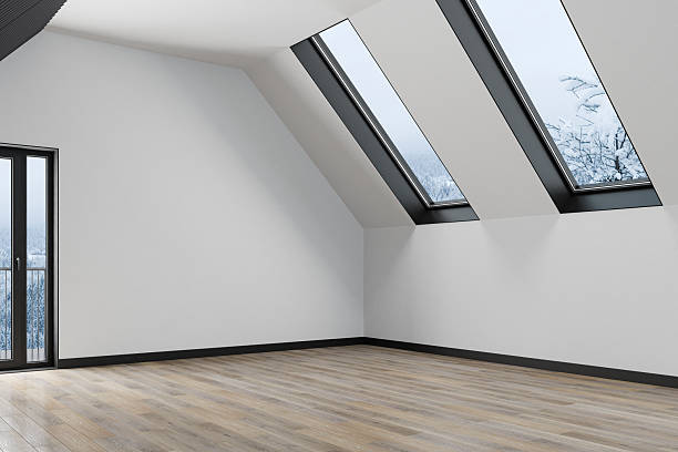 istock Minimalist Attic Interior with Sloped Skylights and White Walls – Unfurnished Space 2220988943