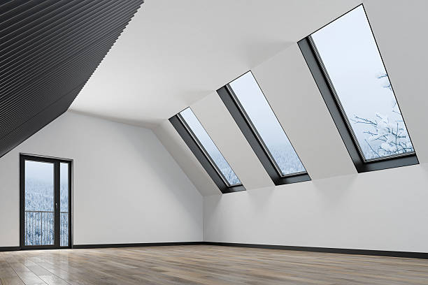 A clean, modern attic spacious room featuring white walls and dramatic sloped ceilings with integrated skylights. The space is unfurnished, showcasing the architectural lines, natural light flow, and spacious layout with wood flooring throughout. Ideal for use in real estate visualizations, renovation concepts, architectural portfolios, or design presentations that focus on space potential, lighting dynamics, and interior planning flexibility.