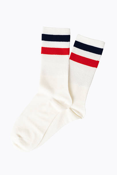 istock White athletic socks with red and navy stripes on plain background 2220989238