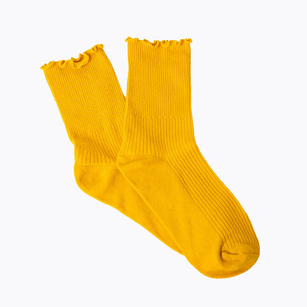 istock Bright yellow ruffled edge socks on white background 2220990504