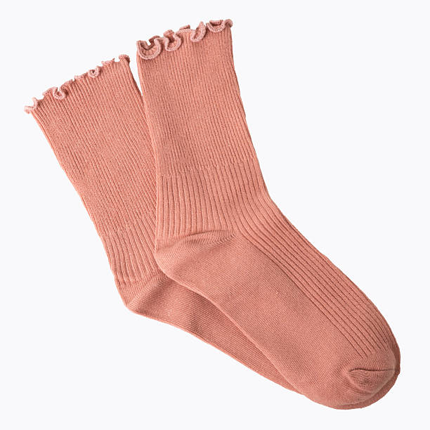 istock Pink knit ruffle socks on white background 2220990733