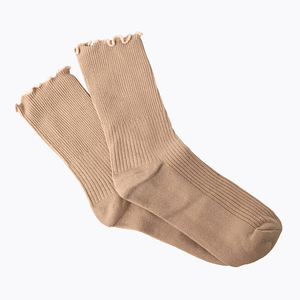 istock Beige ribbed socks with frilled edge on white background 2220990824