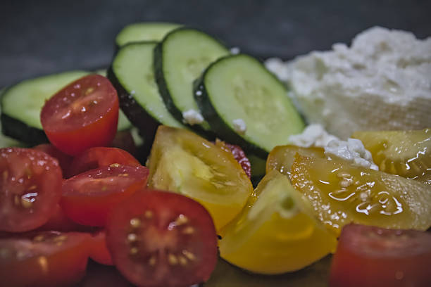 Fresh tomatoes, cucumber and cheese salad close up view
