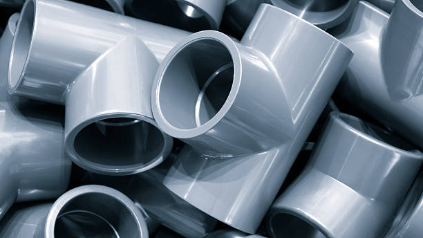istock Grey pvc plumbing pipes corners background closeup 2220992940