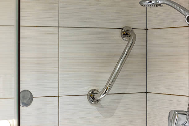 istock Chrome bathroom handle mounted on the wall inside the shower cubicle. 2220993434