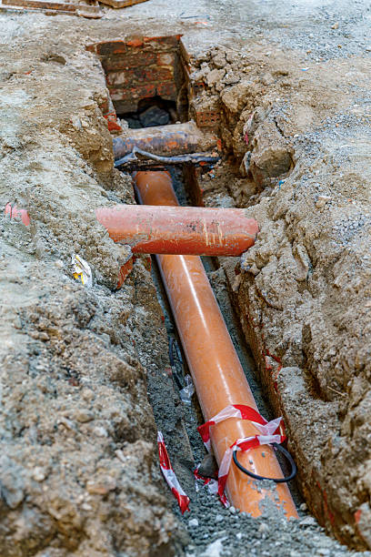 istock Construction Site Showing Underground Orange Plastic Pipes During Streetwork 2220994469