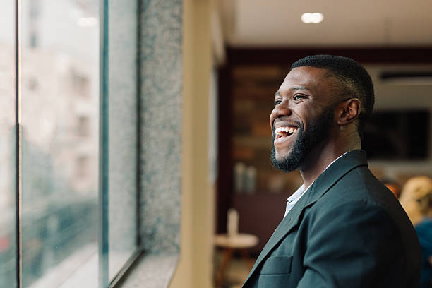 istock Smiling businessman in modern office 2220997016