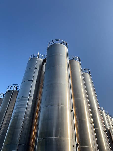 istock Large stack of metal tanks with a clear blue sky in the background 2220998941