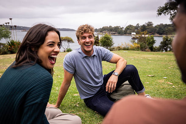 istock Friends Relaxing on the Grass in Sydney Park 2221000704