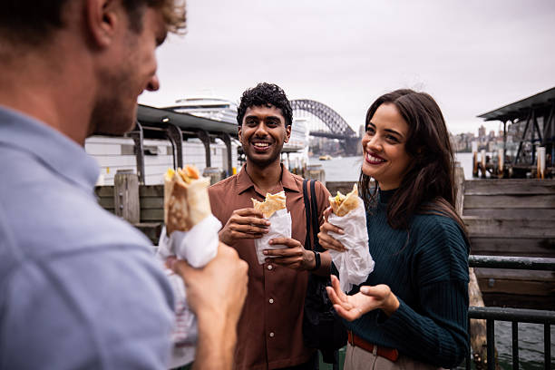 istock Friends Enjoying Wrap Sandwiches Together 2221000841
