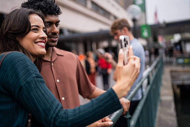 istock Interracial Couple Snapping a Selfie in Urban Sydney 2221001105
