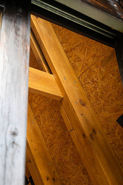 istock Exposed wooden beams and frame forming the structure of a rustic cabin, highlighting natural materials and solid design 2221001710