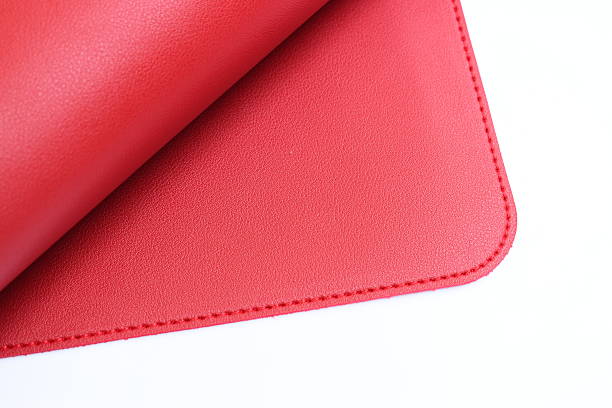 istock shiny red leather texture isolated on white background 2221003324