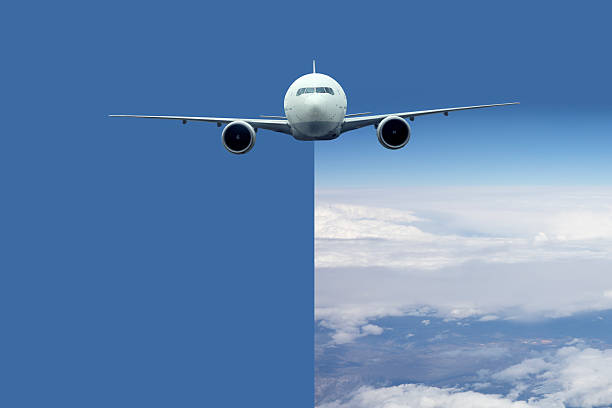 Passenger jet airplane flying above clouds