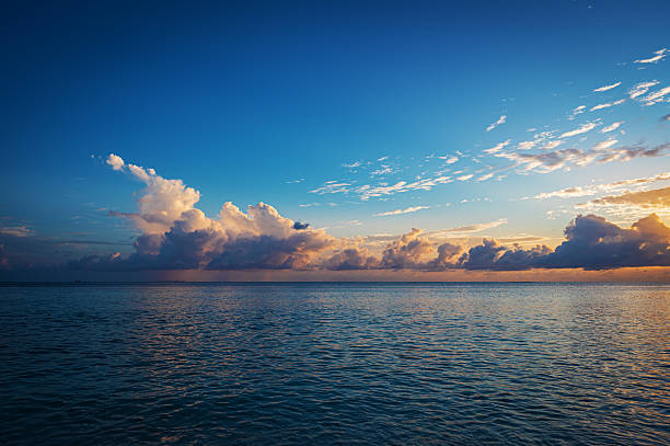 istock Twilight background of sunset over the tropical ocean with dramatic sky and clouds 2221023162