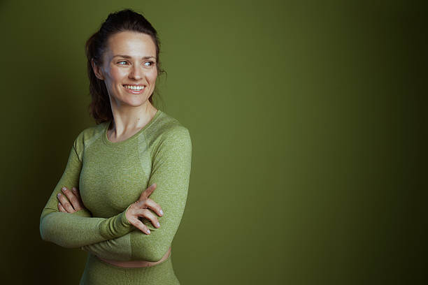 istock Fit middle-aged woman in green top 2221026245