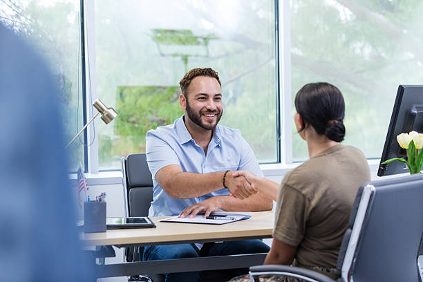istock Job Interview: Handshake Between Businessman and Woman 2221034017