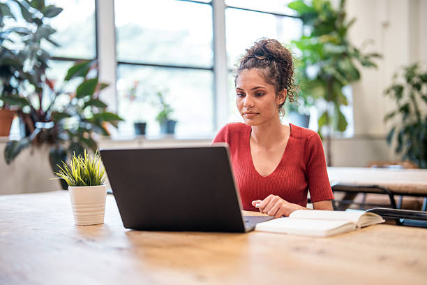 istock Confident Aboriginal Businesswoman Engaging with Laptop 2221037954