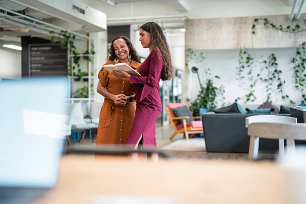 istock Joyful Aboriginal Businesswomen Collaborating in a Modern Office 2221037979