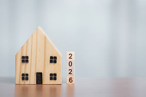Wooden House Model with 2026 Blocks, Symbolizing Future Housing Plans