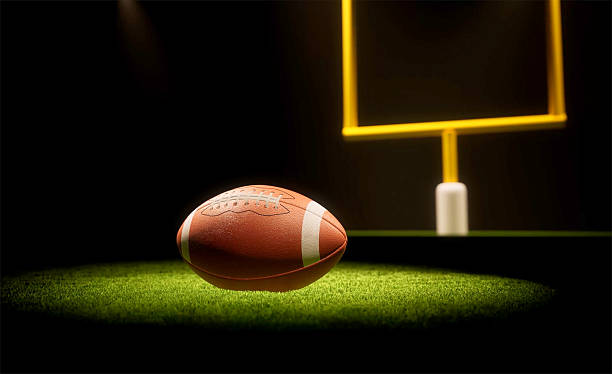 istock Rugby ball with rugby posts on field 2221041728