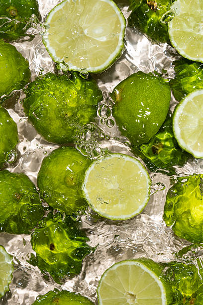 istock Summer Mood Juicy Lime Halves in Water 2221042000