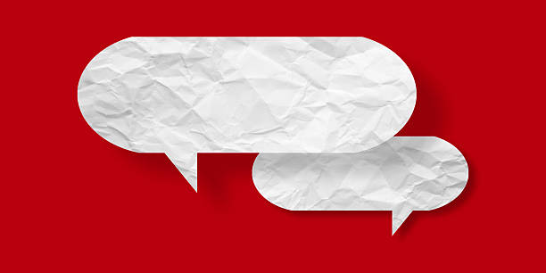 istock White speech bubble crumpled paper isolated on red background 2221047813