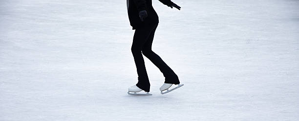 istock young woman in black suit and white skating 2221050048