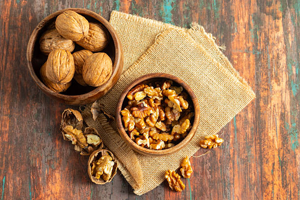 istock Walnuts are nutrient-dense brain-shaped nuts offering rich omega‑3 oils, earthy flavor, crunchy texture, boosting heart health and culinary versatility worldwide 2221052005