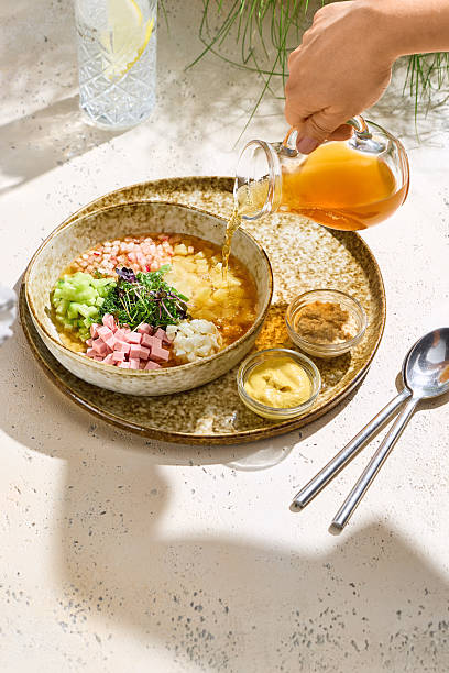 istock Okroshka with kvass bright overhead, sunlit minimal tableware closeup 2221052082