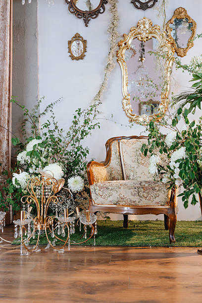 istock Elegant vintage chair surrounded by lush greenery in a stylish decor setting 2221055097
