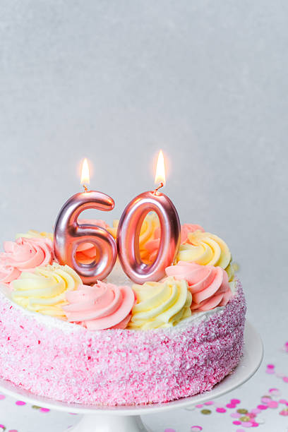 istock Celebrate a special birthday with a decorative 60th cake adorned with candles 2221055107