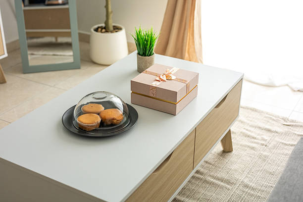 A simple living room showcasing with white coffee table in scandinavian style