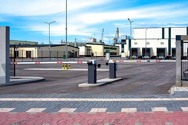 istock Security checkpoint at logistics center gate. Factory exterior with automatic gate barrier 2221056373