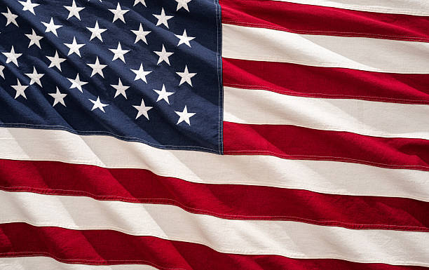 istock American flag waving in the wind under sunlight, symbolizing national pride and unity 2221058905