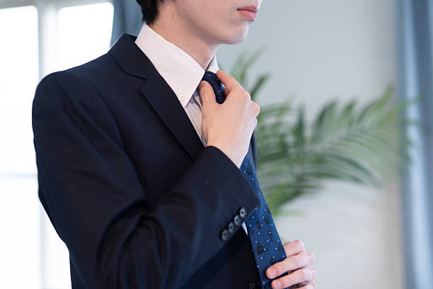 istock Close-up of a man adjusting his tie 2221058970