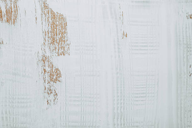 istock Textured white wooden surface with peeling areas and rustic charm 2221059507