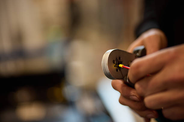 istock Close-Up of Crimping Tool in Use With Red and Yellow Electrical Wire 2221061313