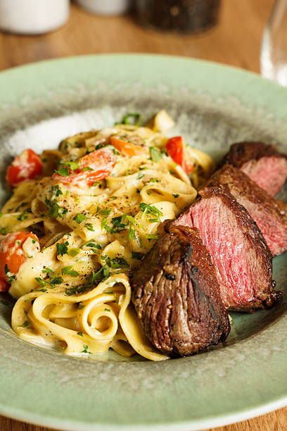 Creamy tagliatelle with grilled steak and cherry tomatoes