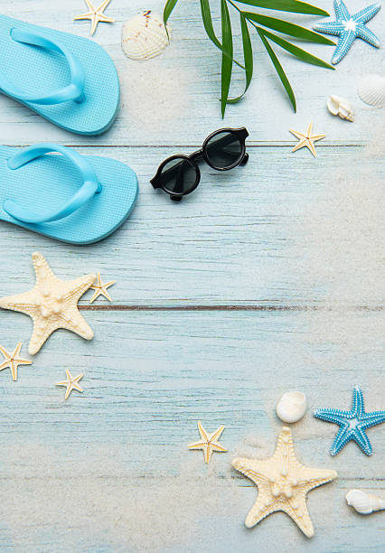 istock Summer beach essentials on wooden background 2221061788