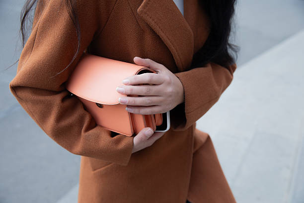 istock woman holding bag 2221065354