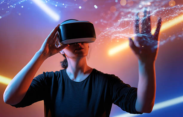 istock Woman with VR virtual reality goggles 2221068918